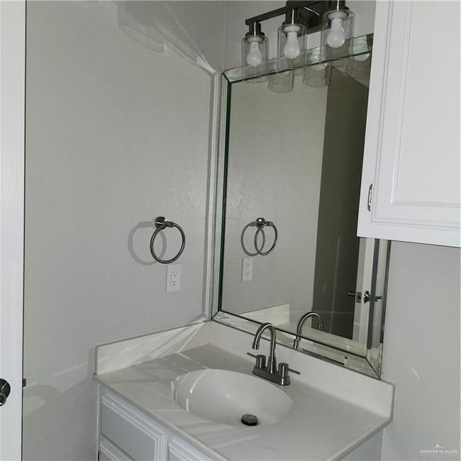 Bathroom featuring vanity | Image 6
