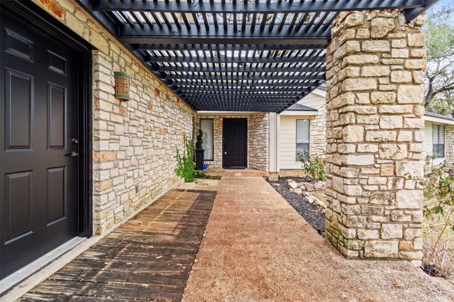 Doorway to property featuring a pergola | Image 4