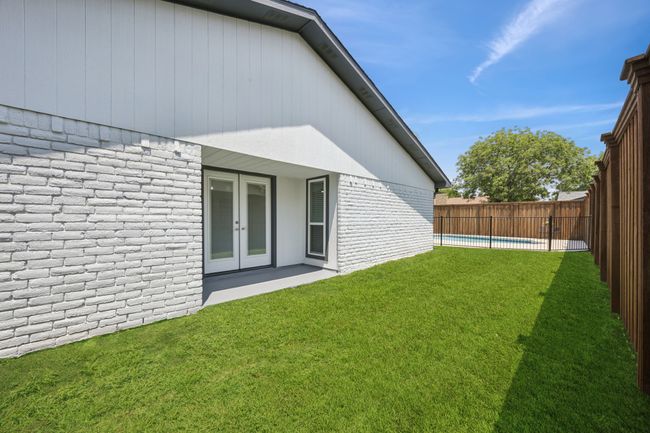 This large grassy area is right off the Formal Dining Area and backyard! | Image 23
