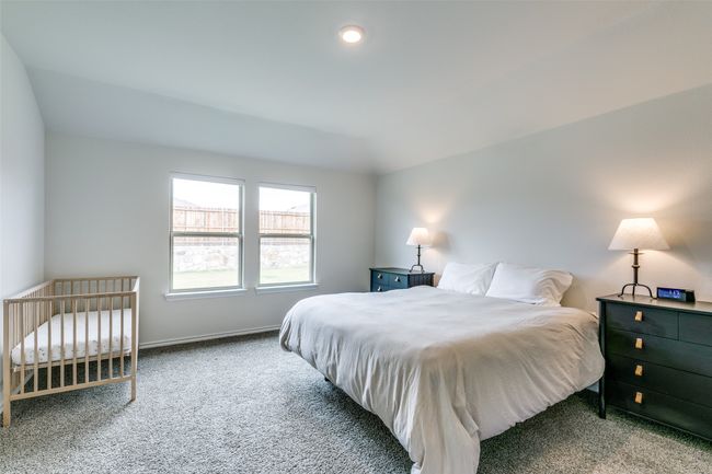 Carpeted bedroom with vaulted ceiling | Image 13