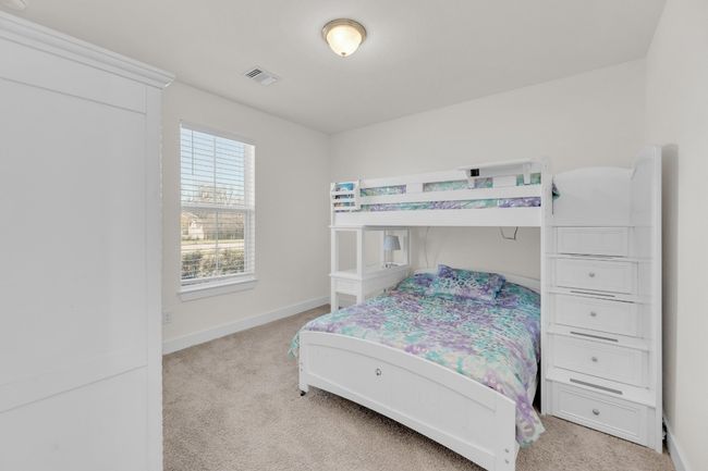 Bedroom with light carpet, visible vents, and baseboards | Image 33