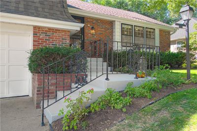 Brick Trim, Metal Siding, and Freshly Updated Split-Steps Welcome You Inside. | Image 3