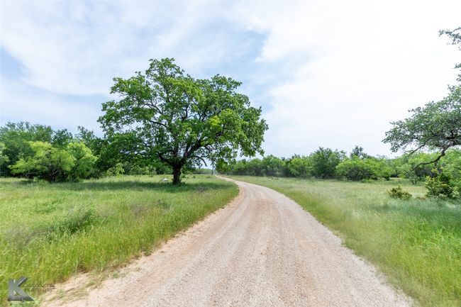 View of dirt / gravel road | Image 6