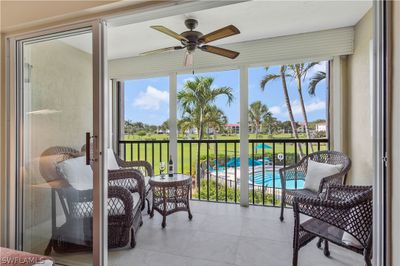 Sunroom / solarium with ceiling fan | Image 1