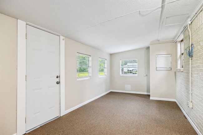 Sunroom New carpet, new back door, fresh paint. Room is cooled by window unit | Image 19