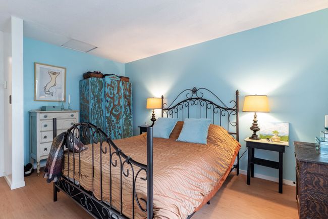 Bedroom featuring light wood-style flooring, attic access, and baseboards | Image 16