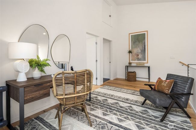 Upstairs, you'll discover an additional two bedrooms, a full bath, access to your roof deck, and a bonus flex space, providing ample room for relaxation, privacy, and versatile living. | Image 16