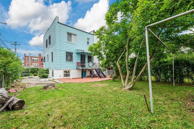 Rear view of property featuring a patio and a yard | Image 20