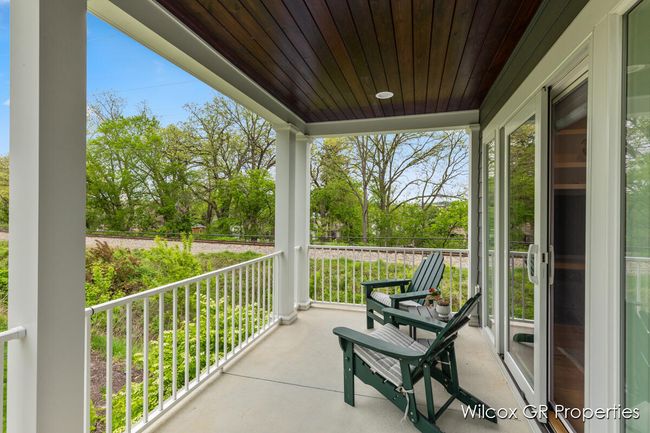 Cozy porch with the most private of settings at RiverPoint of Ada with wooded views. | Image 4