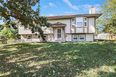 Bi-level home with a front lawn | Image 1