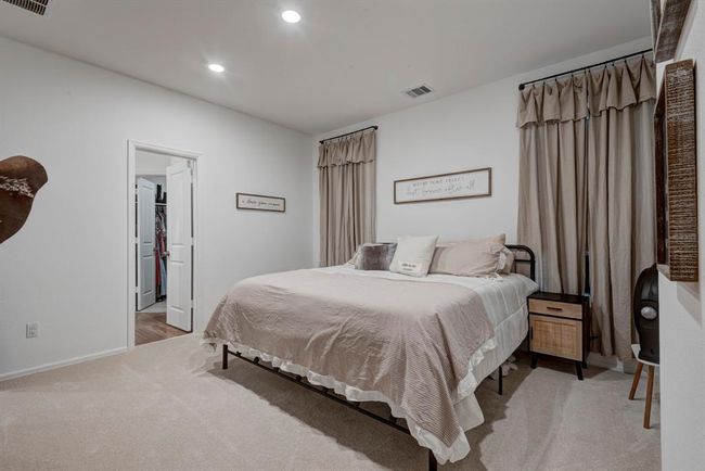 The primary bedroom is cozy as it is spacious. New carpet was recently installed. | Image 17