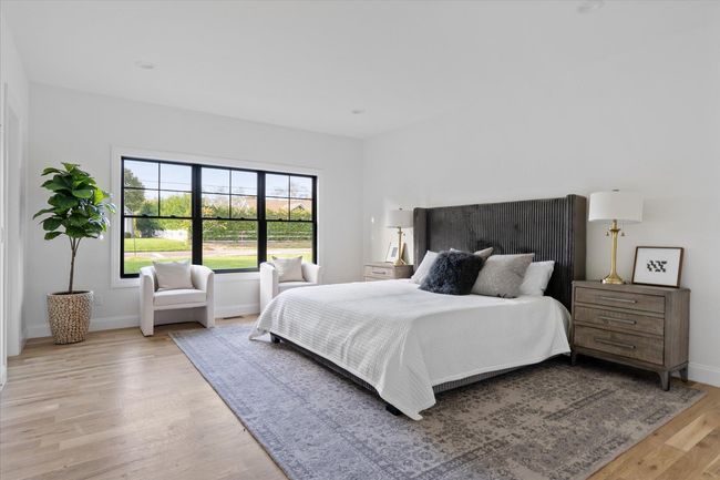 Bedroom featuring light wood-type flooring | Image 16