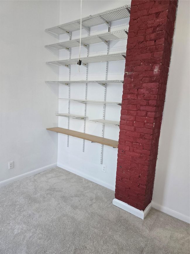 Carpeted spare room with baseboards | Image 17
