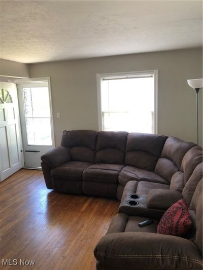 Living room featuring dark hardwood / wood-style flooring | Image 2