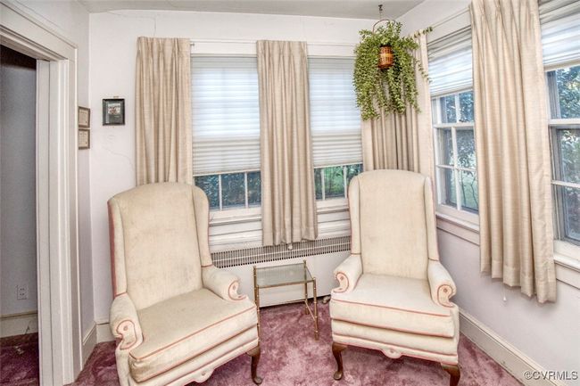 Sitting room with carpet flooring and baseboards | Image 15