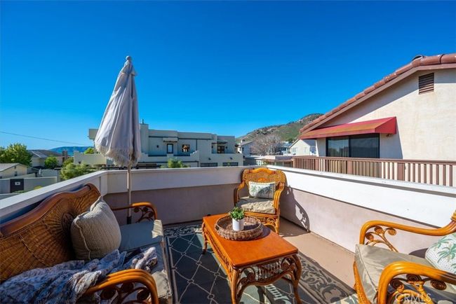 Balcony off master suite provides a cozy place to enjoy morning coffee or unwind at the end of the day | Image 38