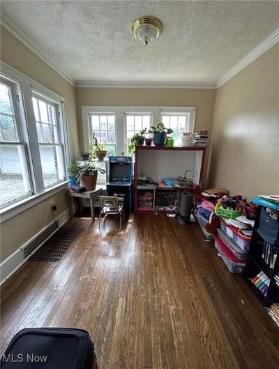 Office area with ornamental molding, dark hardwood / wood-style floors, and a textured ceiling | Image 2