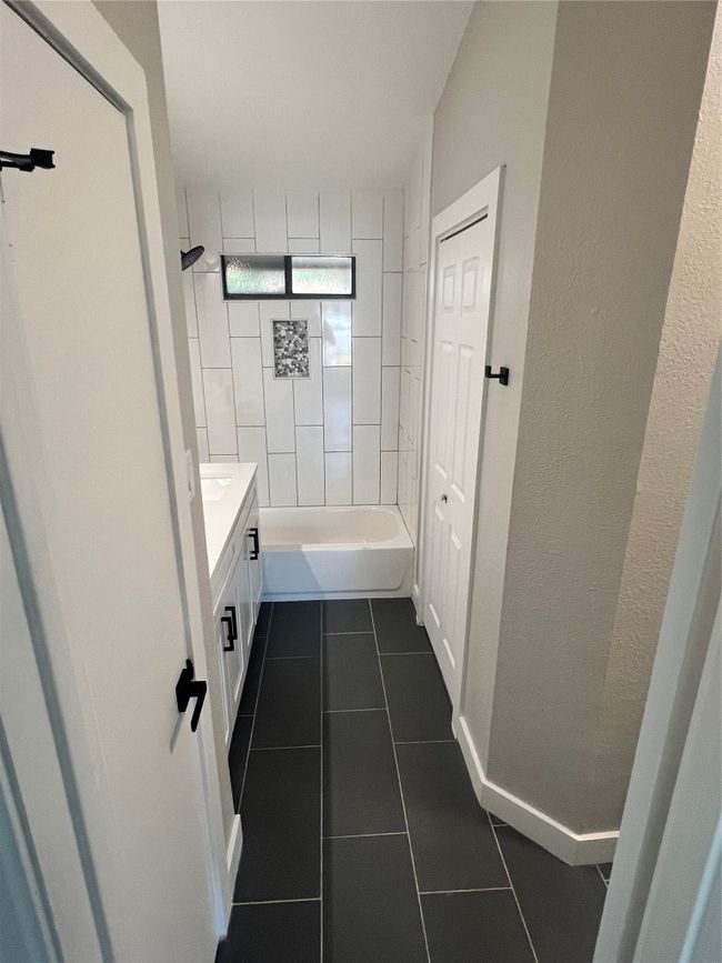 Bathroom with tile patterned floors and vanity | Image 14