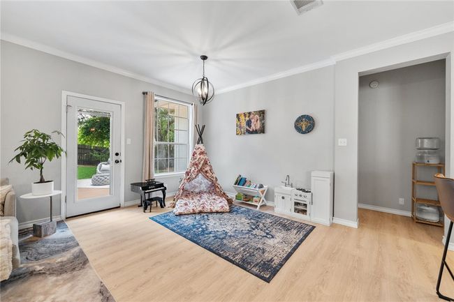 A second dining area is located just off the kitchen with direct access to the expansive wood deck. | Image 11