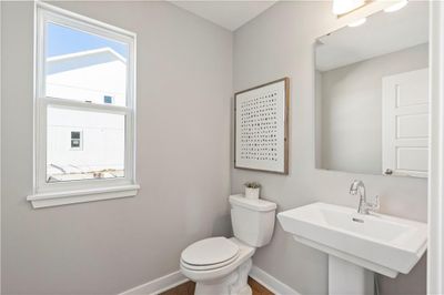 Living room featuring dark wood-type flooring, sink, and beverage cooler | Image 3