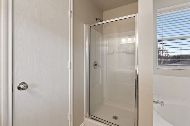 Full bath featuring a shower stall and a garden tub | Image 21