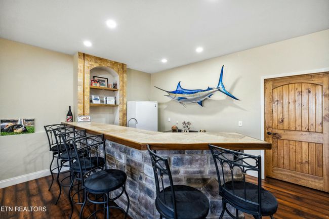 Equipped with a refrigerator, sink and plenty of storage. | Image 38