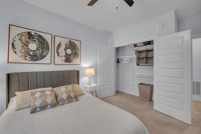 Carpeted bedroom featuring a closet and a ceiling fan | Image 19