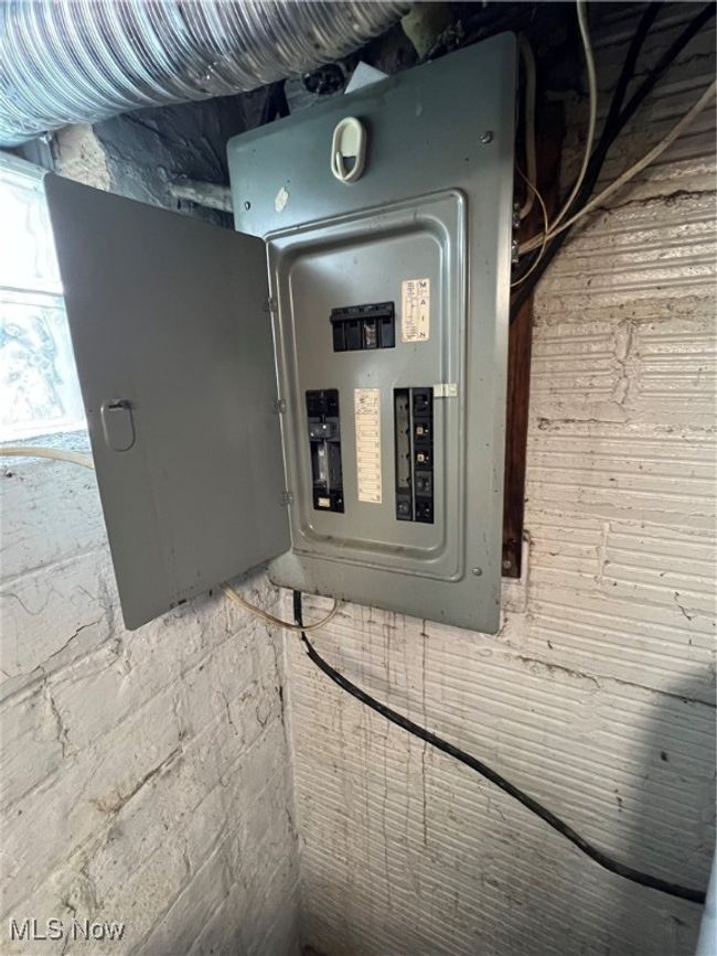 Utility room featuring electric panel | Image 14