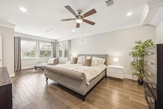 Retreat to your primary bedroom suite with tray ceilings on the second floor. Huge windows overlook the back patio. | Image 19