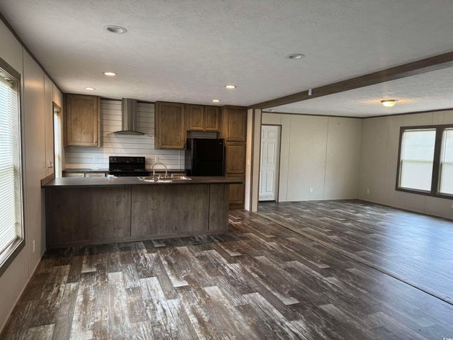 Walk in closet featuring dark wood-type flooring | Image 17