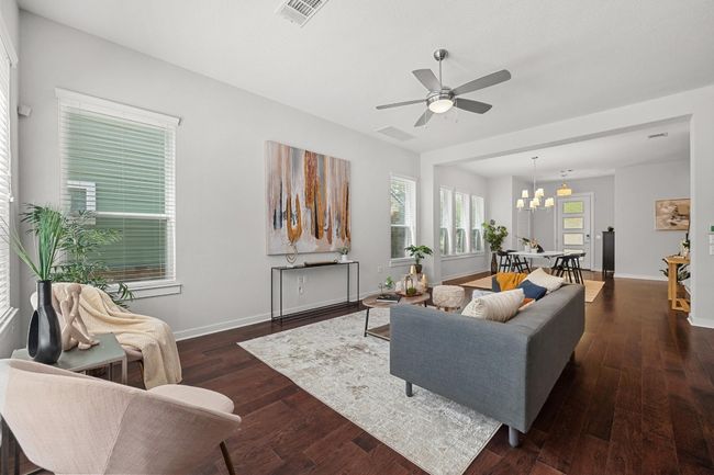 The neutral-toned walls in the living room provide the perfect canvas to personalize and make the space truly your own, whether you prefer bold colors or subtle accents | Image 10