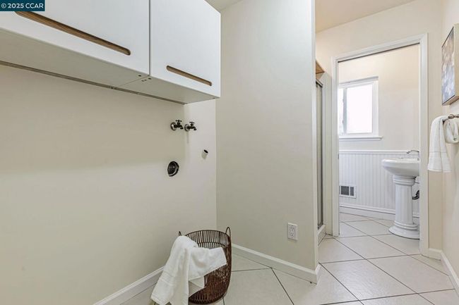 Laundry room on lower level with bathroom & shower. | Image 24