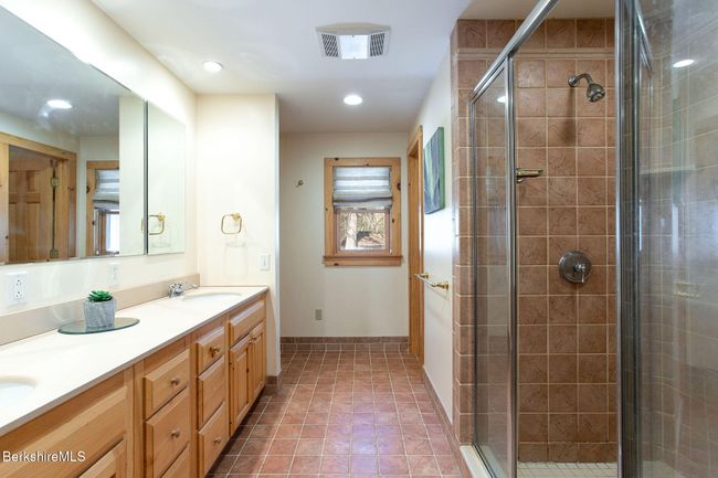 Primary #1 en suite with walk in shower, double sink vanity and separate wash closet. | Image 14