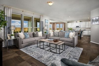 This light and bright spacious living room is the perfect layout for entertaining or just relaxing! Whether it's simply a night in or entertaining family and friends, this home has ample open space for everyone to enjoy! Featuring large tile flooring, large windows, and high ceilings. | Image 3