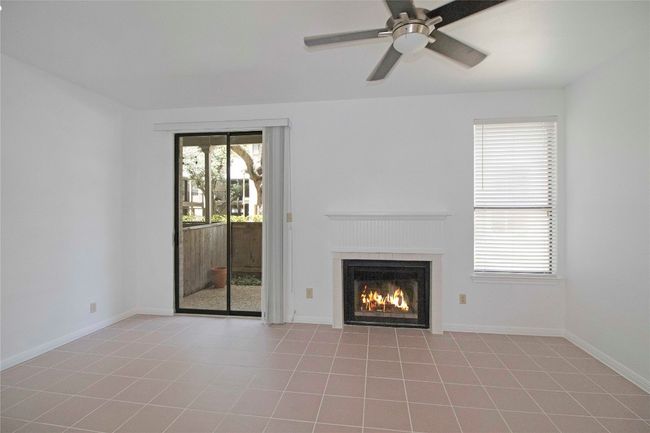 Living and Dining Combo with Sliding door to Private downstairs courtyard and WBFP. | Image 22