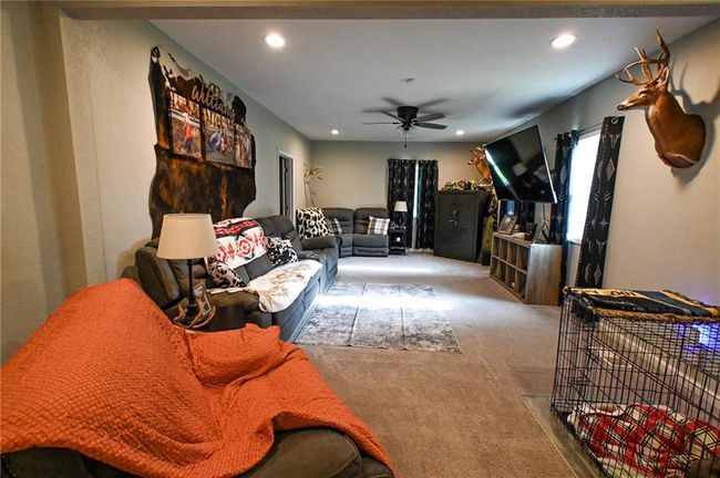 Living area featuring carpet, ceiling fan, and recessed lighting | Image 17