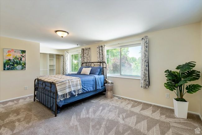 Carpeted bedroom featuring baseboards | Image 39