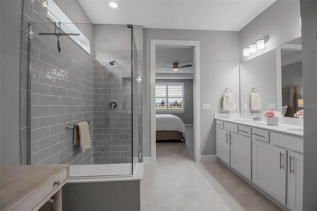 Frameless glass surrounds the walk in shower | Image 38
