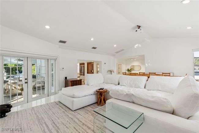 Living room with visible vents, french doors, recessed lighting, and lofted ceiling | Image 13