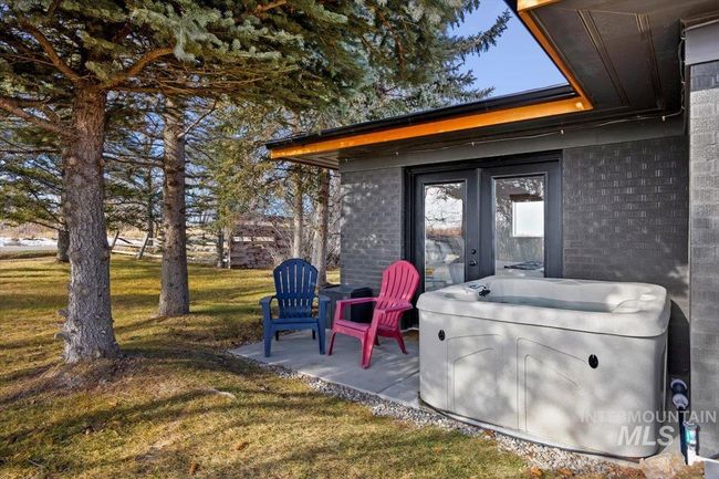 View of patio / terrace with a hot tub and french doors | Image 21