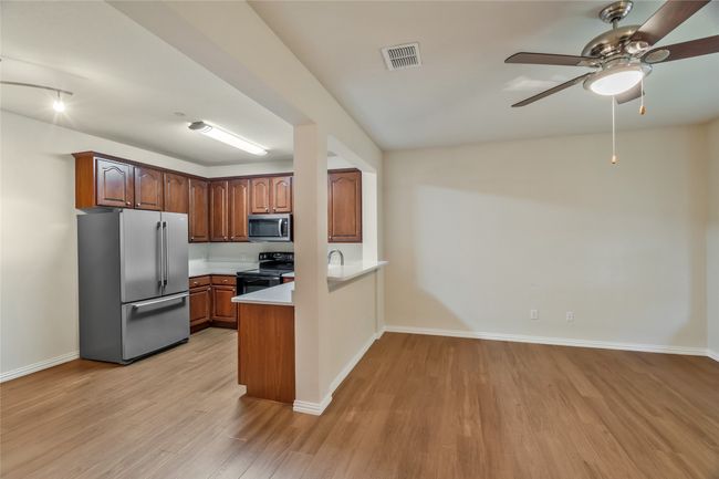 Eat-in kitchen. Refrigerator will stay and convey | Image 6