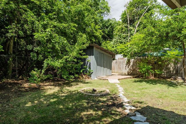 Fenced backyard with a shed | Image 20