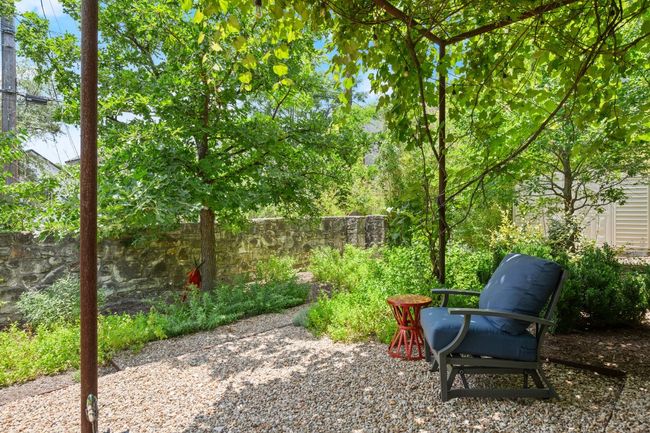 View of the historic stone wall and secret wooden door. | Image 36