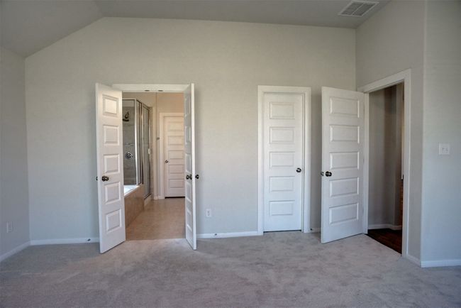 Unfurnished bedroom with carpet, visible vents, and baseboards | Image 20