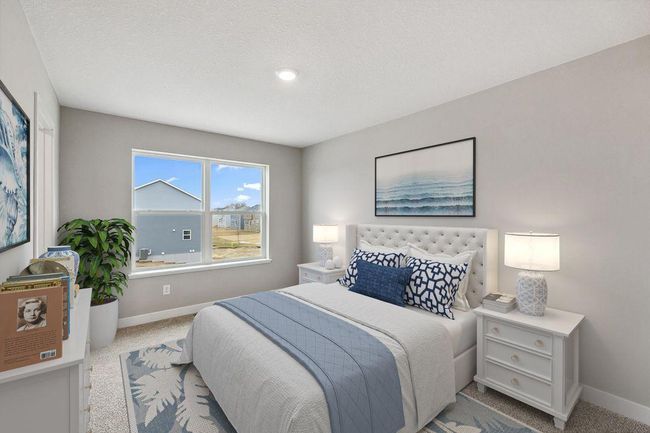 Primary bedroom with walk-in closet and private bath. Model home. Options and colors will vary. | Image 18
