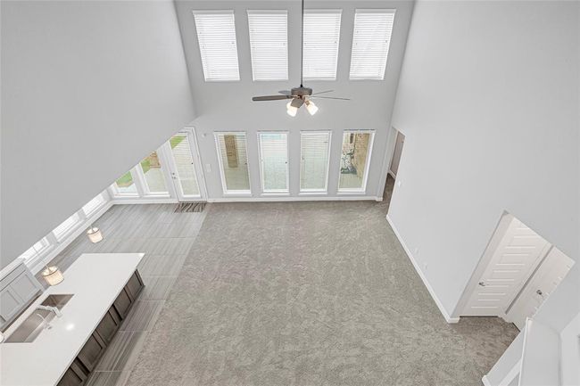 Views from the mezzanine to the family room. | Image 22