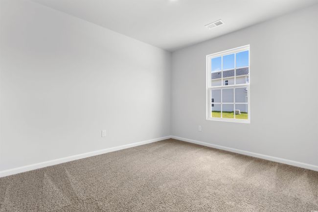 View of carpeted spare room | Image 9