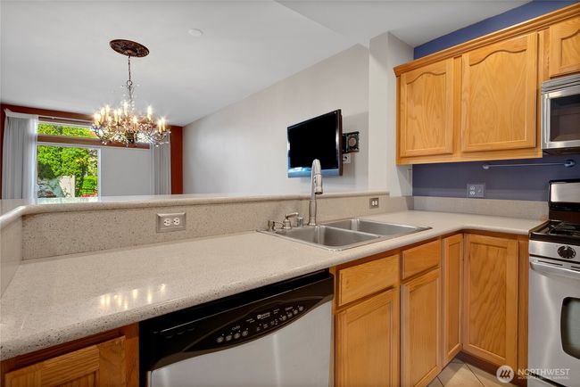 Kitchen looks into dining/living | Image 6