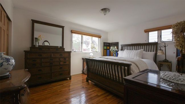Bedroom featuring hardwood / wood-style floors | Image 8