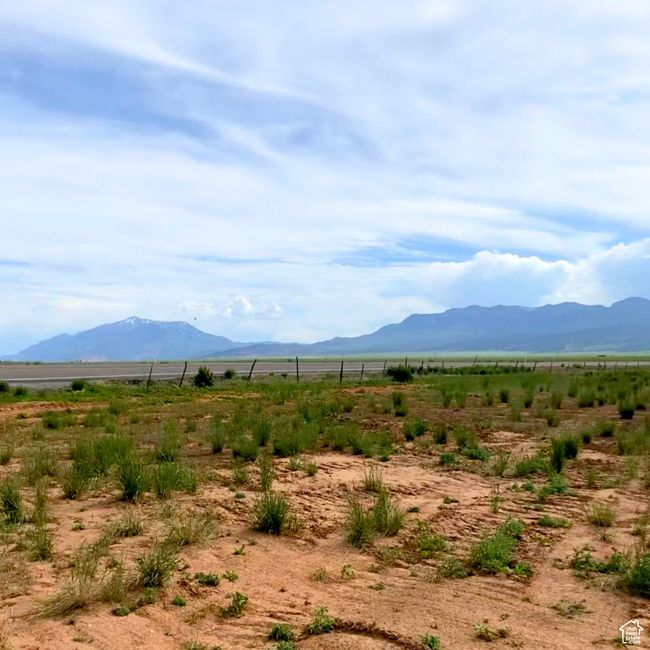 View of mountain backdrop featuring rural landscape | Image 7